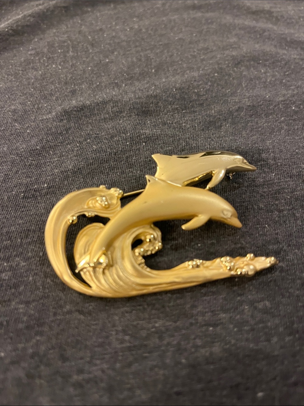 AJC gold tone brooch